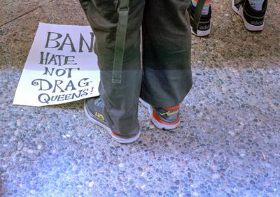 a scan of a color photo of a sign that says Ban Hate Not Drag Queens