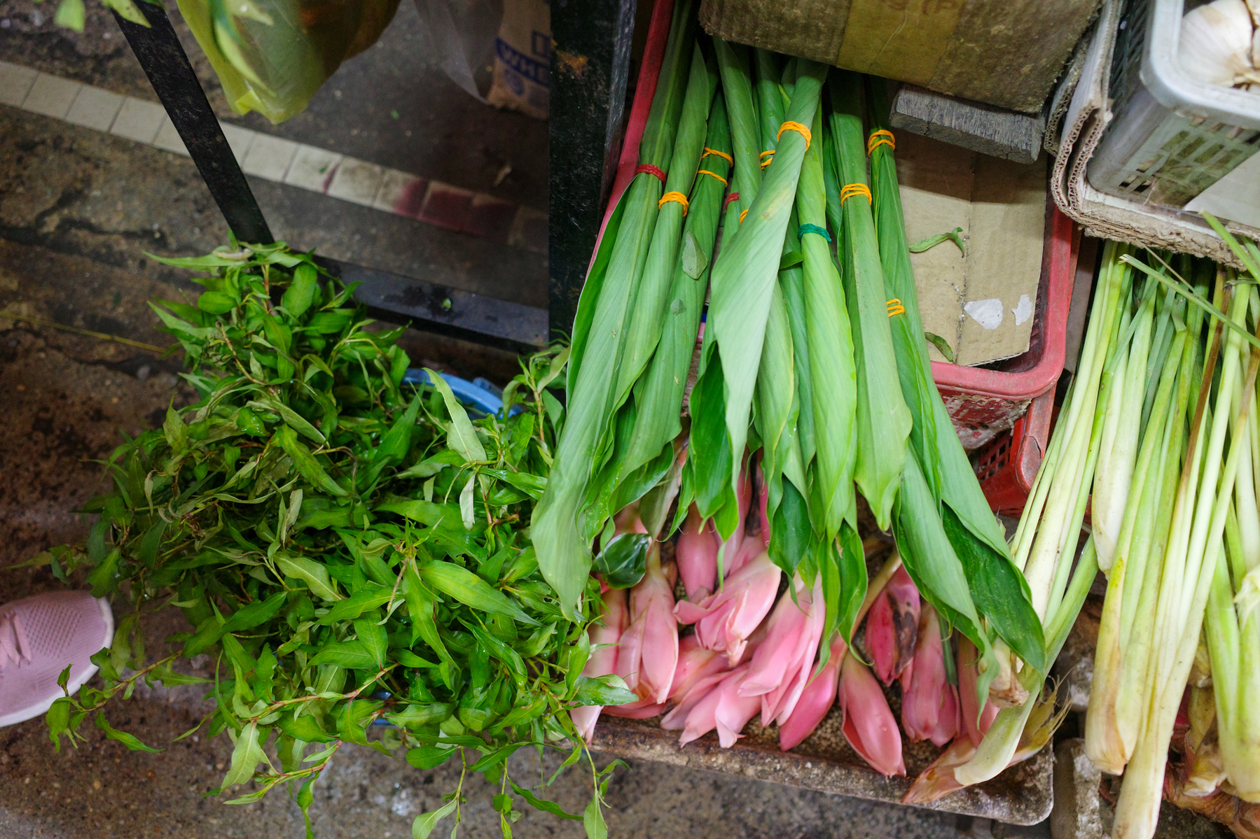 a digital photograph of a market in Malaysia with a menu for all kinds of noodles and items