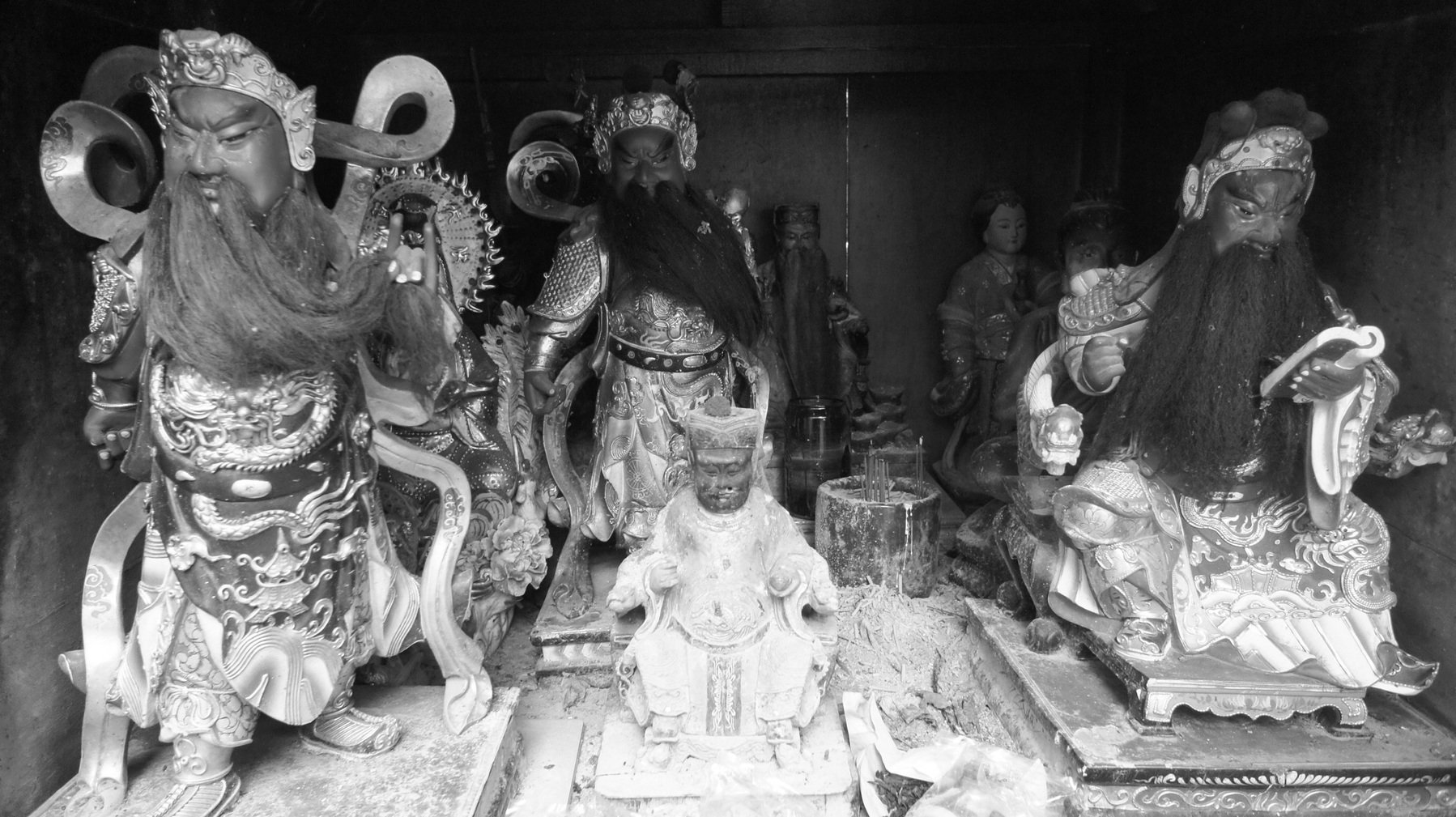 A black and white photo of a close up of Chinese gods