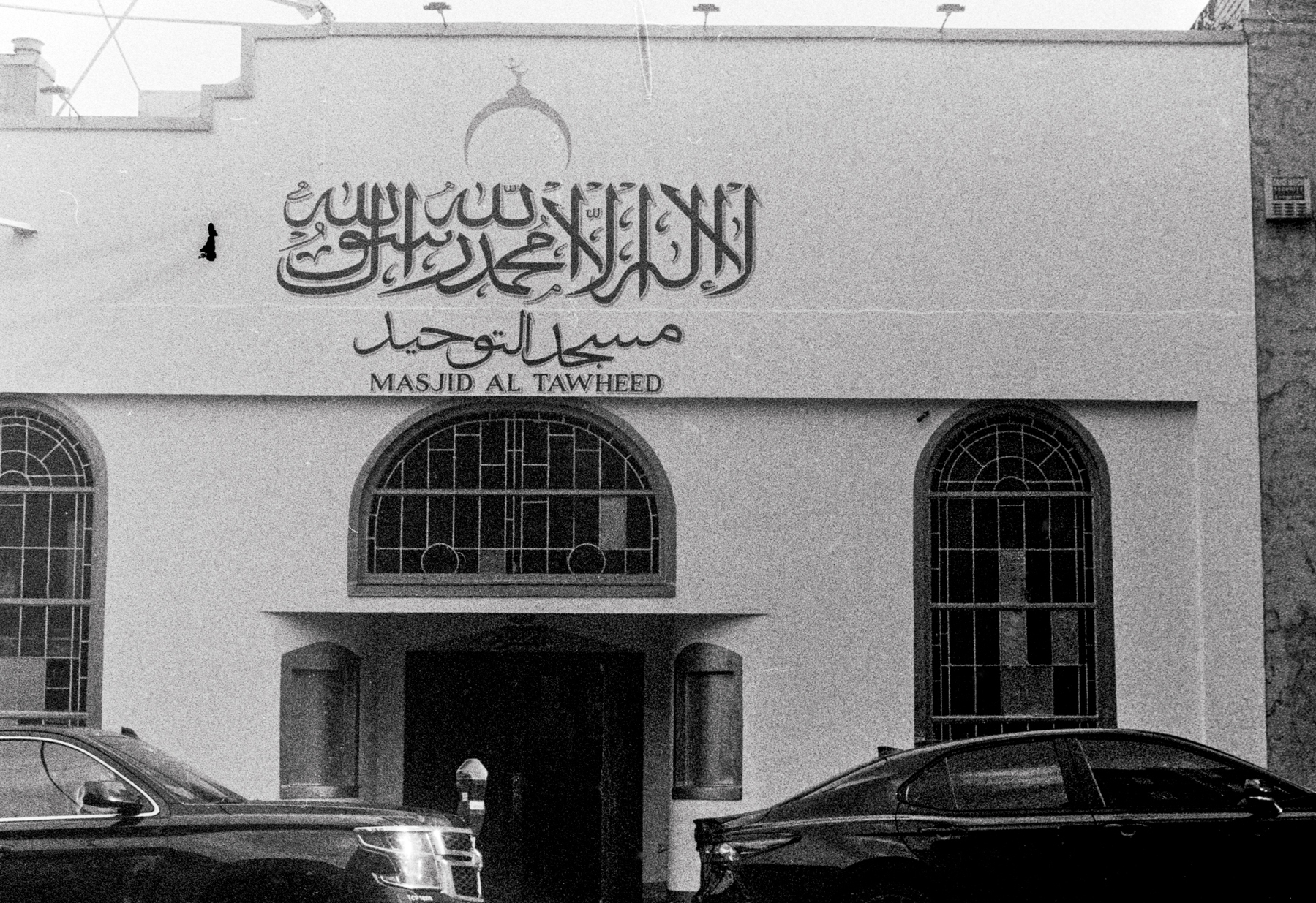 a scan of a black and white photo showing a mosque in San Francisco with the name Masjid Al Tawheed