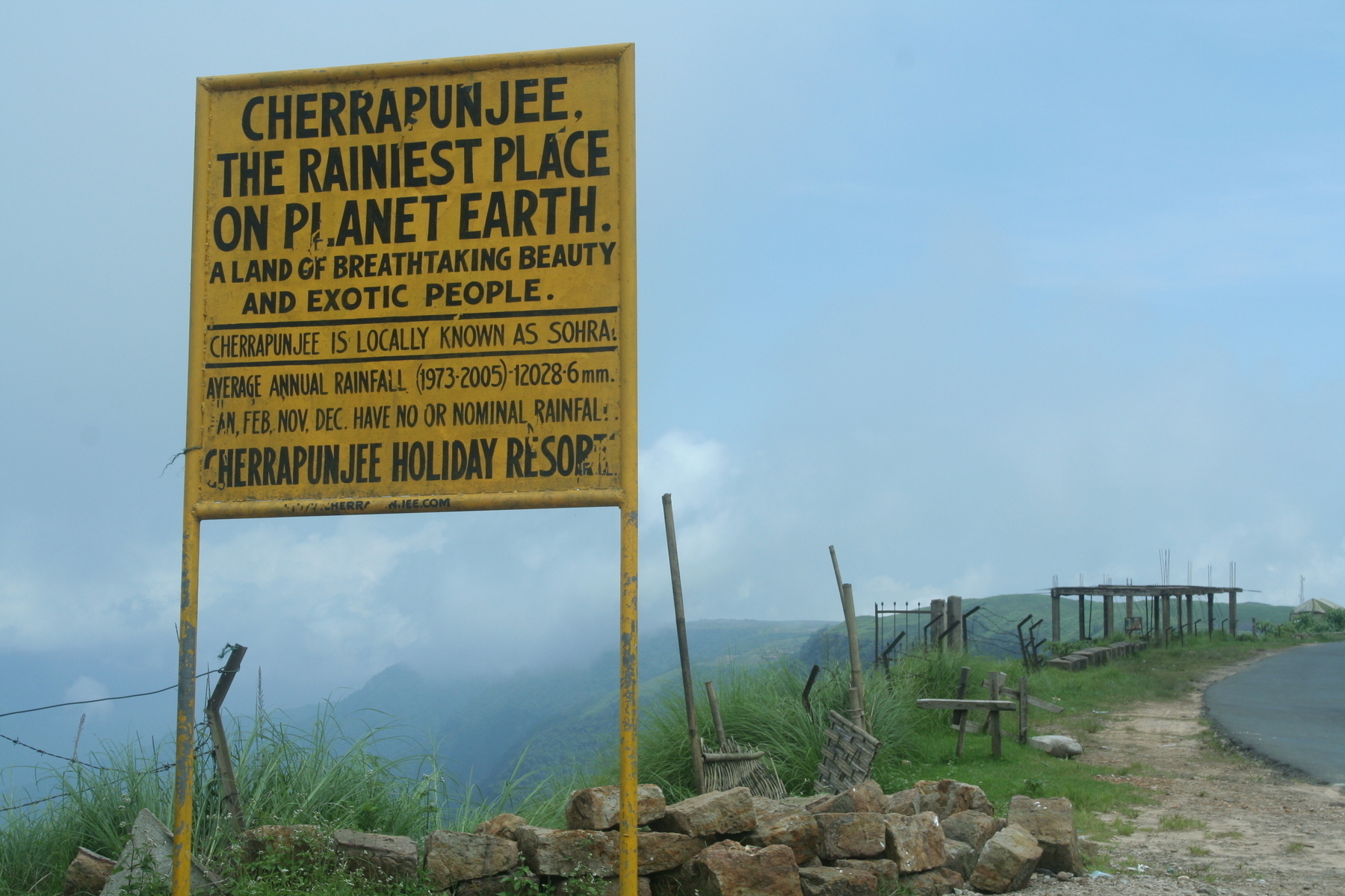 a color photo of a sign that reads, Cherrapunjee, wettest place in the world