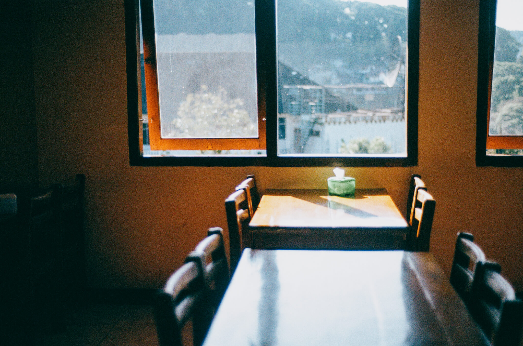 Photo of a window in a restaurant in East Java Indonesia with sunlight streaming in