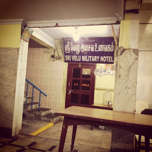 a photo of the insides of a restaurant in Chennai that says Sri Velu Military Hotel