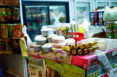 3. A scan of a color photo of a few worship items at a Burmese grocer in Singapore