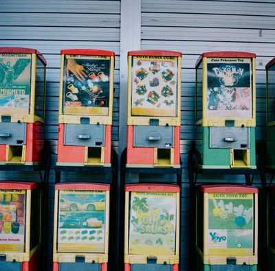 A scan of a color photo of old arcade and game machines in Tanglin Halt, Singapore