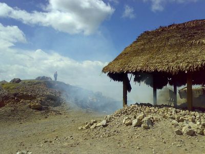 a color photo of a kiln in a limestone mining area in India