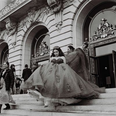 a scan of a black and white photo of a bride coming out of San Francisco City Hall