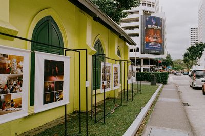 a scan of a color photo showing a historical green building