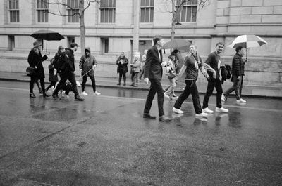 a scan of a black and white photograph of a group of people participating in the St Patrick's Day parade in San Francisco