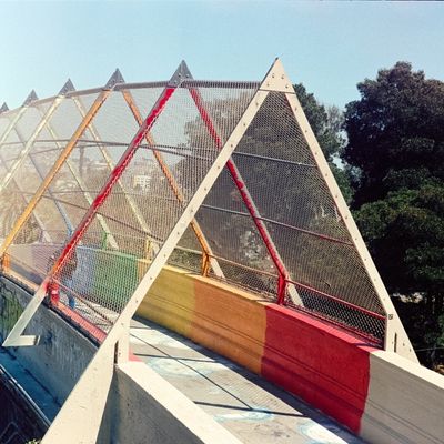 a scan of a color photo of a colorful bridge in the Castro in San Francisco in a cropped square format