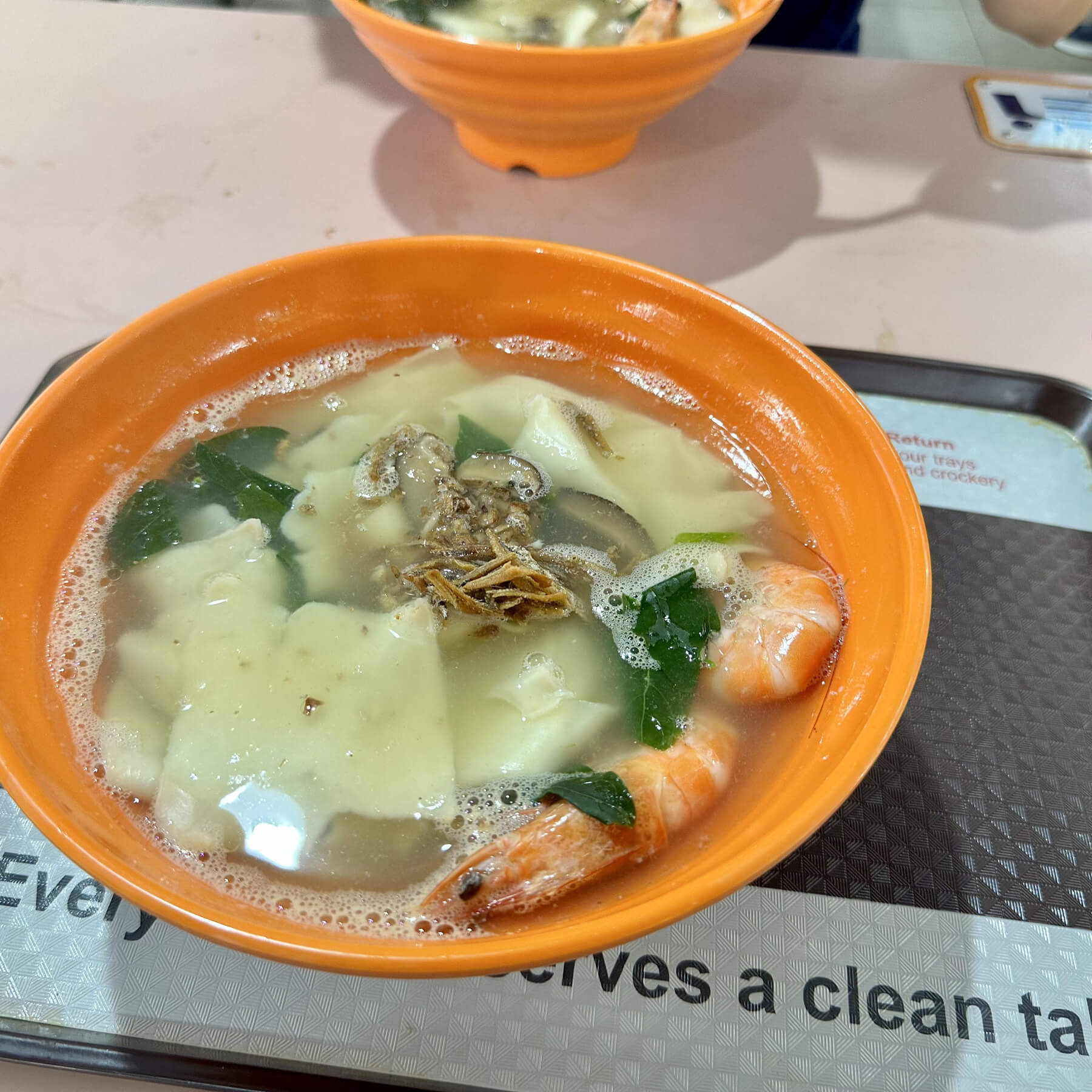 a photo of a bowl of noodle soup with a shrimp